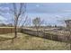 Large, fenced backyard with mature trees and plenty of space for outdoor activities at 2201 Sable Blvd # 1008, Aurora, CO 80011