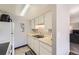 Functional kitchen with white cabinetry, appliances, and efficient layout at 2201 Sable Blvd # 1008, Aurora, CO 80011