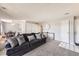 Comfortable living room with plush carpeting, a large sofa, and ample natural light at 2201 Sable Blvd # 1008, Aurora, CO 80011