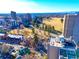 Aerial view of a city neighborhood with parks, buildings, and tree lined streets at 1313 N Williams St # 1103, Denver, CO 80218