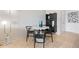 Dining area features a round table with seating for four and modern decor at 1313 N Williams St # 1103, Denver, CO 80218