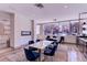 Stylish dining area with a sleek fireplace and views of the surrounding neighborhood at 1313 N Williams St # 1103, Denver, CO 80218