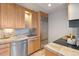 Well-lit kitchen with stainless steel appliances, granite countertops, and ample storage space at 1313 N Williams St # 1103, Denver, CO 80218