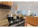 Modern kitchen with stainless steel appliances and granite countertops at 1313 N Williams St # 1103, Denver, CO 80218