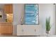 Living room with stylish console, modern art, and elegant plant at 1313 N Williams St # 1103, Denver, CO 80218