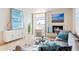 Bright living room featuring modern decor, fireplace, and balcony access with city views at 1313 N Williams St # 1103, Denver, CO 80218