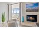 Living room showcases a fireplace, comfortable seating, and balcony doors with bright city views at 1313 N Williams St # 1103, Denver, CO 80218