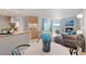 Open-concept living space featuring the dining area, kitchen, and living room with a fireplace at 1313 N Williams St # 1103, Denver, CO 80218
