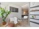 Cozy sunroom with comfortable seating and shelving at 1313 N Williams St # 1103, Denver, CO 80218