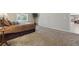 Bedroom featuring carpet, neutral walls, and a glimpse into the rest of the house at 17720 Canterbury Dr, Monument, CO 80132