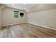 An airy bedroom with hardwood floors and a window showcases natural light and cozy charm at 17720 Canterbury Dr, Monument, CO 80132