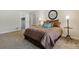 Cozy bedroom with a queen-sized bed, carpet flooring, and neutral color palette at 17720 Canterbury Dr, Monument, CO 80132