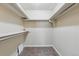 Walk-in closet with ample shelving and a carpeted floor at 17720 Canterbury Dr, Monument, CO 80132