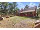 Spacious yard surrounding the home with mature trees at 17720 Canterbury Dr, Monument, CO 80132