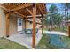 Inviting patio area with a pergola and string lights, perfect for outdoor dining and relaxation at 17720 Canterbury Dr, Monument, CO 80132