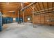 Large shop space with high ceilings, exposed beams, and multiple storage cabinets, ideal for projects at 17720 Canterbury Dr, Monument, CO 80132
