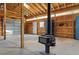 Spacious workshop featuring a functional layout, natural light, and a wood burning stove at 17720 Canterbury Dr, Monument, CO 80132