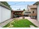 Lush backyard with a gazebo, outdoor seating, well-maintained lawn, and ambient string lights at 3008 N York St, Denver, CO 80205