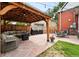 Backyard patio featuring outdoor seating area with grill and pergola at 3008 N York St, Denver, CO 80205