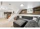Basement space with comfortable seating, unique wood wall, and additional workspace at 3008 N York St, Denver, CO 80205