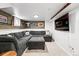 Relaxing basement space featuring comfortable seating and a unique wood wall decor at 3008 N York St, Denver, CO 80205