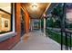 Inviting front porch features a swing, hanging flowers, and a 'Hello' doormat at 3008 N York St, Denver, CO 80205