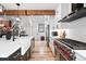 Bright kitchen with stainless steel appliances, white cabinets, and an open concept design at 3008 N York St, Denver, CO 80205