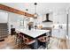 Modern kitchen with a large island, stylish pendant lights, and ample seating at 3008 N York St, Denver, CO 80205