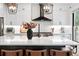 Modern kitchen boasts a large island, updated appliances, and stylish black accents at 3008 N York St, Denver, CO 80205