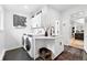 Well-equipped laundry room with modern washer and dryer and ample counter space at 3008 N York St, Denver, CO 80205