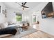 Cozy living room with modern furnishings, hardwood floors, and a large sectional sofa at 3008 N York St, Denver, CO 80205