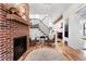 Open-concept living room features a fireplace and staircase leading to the upper level at 3008 N York St, Denver, CO 80205