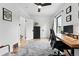 Bright office boasts neutral colors, a ceiling fan, and a dedicated workspace with desk at 3008 N York St, Denver, CO 80205