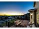 Comfortable back deck with scenic views during the transition from day to night at 4157 Astrion Ct, Castle Rock, CO 80104