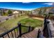 Well-manicured backyard with a spacious lawn and a view of the surrounding neighborhood at 4157 Astrion Ct, Castle Rock, CO 80104