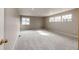 Spacious bonus room with ample natural light from three windows, offering flexibility for various activities or a home office at 4157 Astrion Ct, Castle Rock, CO 80104