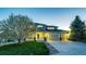 Charming two-story home with a three-car garage and blossoming tree at 4157 Astrion Ct, Castle Rock, CO 80104