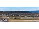 Distant mountain views for a home surrounded by other single Gathering homes at 4157 Astrion Ct, Castle Rock, CO 80104