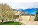 Charming two-story home featuring a well-manicured lawn and an attached two-car garage at 4157 Astrion Ct, Castle Rock, CO 80104