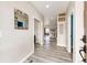 A welcoming hallway with hard surface floors leads to the main living spaces at 4157 Astrion Ct, Castle Rock, CO 80104