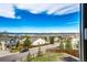 A scenic view from a window overlooking houses and the community at 4157 Astrion Ct, Castle Rock, CO 80104