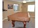 Finished basement game room with a covered pool table, two windows and recessed lighting at 6368 S Walden Way, Aurora, CO 80016