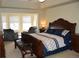 Large bedroom with a sitting area, vaulted ceilings, and a luxurious, ornate, king-size bed at 6368 S Walden Way, Aurora, CO 80016