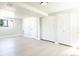 Finished basement featuring light hardwood floors, neutral paint, and closet storage at 10932 W 107Th Ave, Broomfield, CO 80021