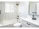 Bathroom with a bathtub, tiled shower walls and a black shower head at 10932 W 107Th Ave, Broomfield, CO 80021