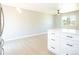 Modern kitchen with new white cabinets, quartz countertops, stainless steel appliances and open layout at 10932 W 107Th Ave, Broomfield, CO 80021