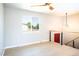 Bright living area with contemporary light fixture, natural light, wood-look floors and open staircase at 10932 W 107Th Ave, Broomfield, CO 80021