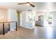 Bright and airy living room featuring sleek floors, modern railings and open concept layout with kitchen at 10932 W 107Th Ave, Broomfield, CO 80021