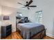 Cozy bedroom with a comfortable bed, ceiling fan, and two windows that provide ample natural light at 530 S Ames St, Lakewood, CO 80226
