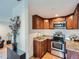 Efficient kitchen with stainless steel appliances, granite countertops, and stylish wood cabinetry at 530 S Ames St, Lakewood, CO 80226
